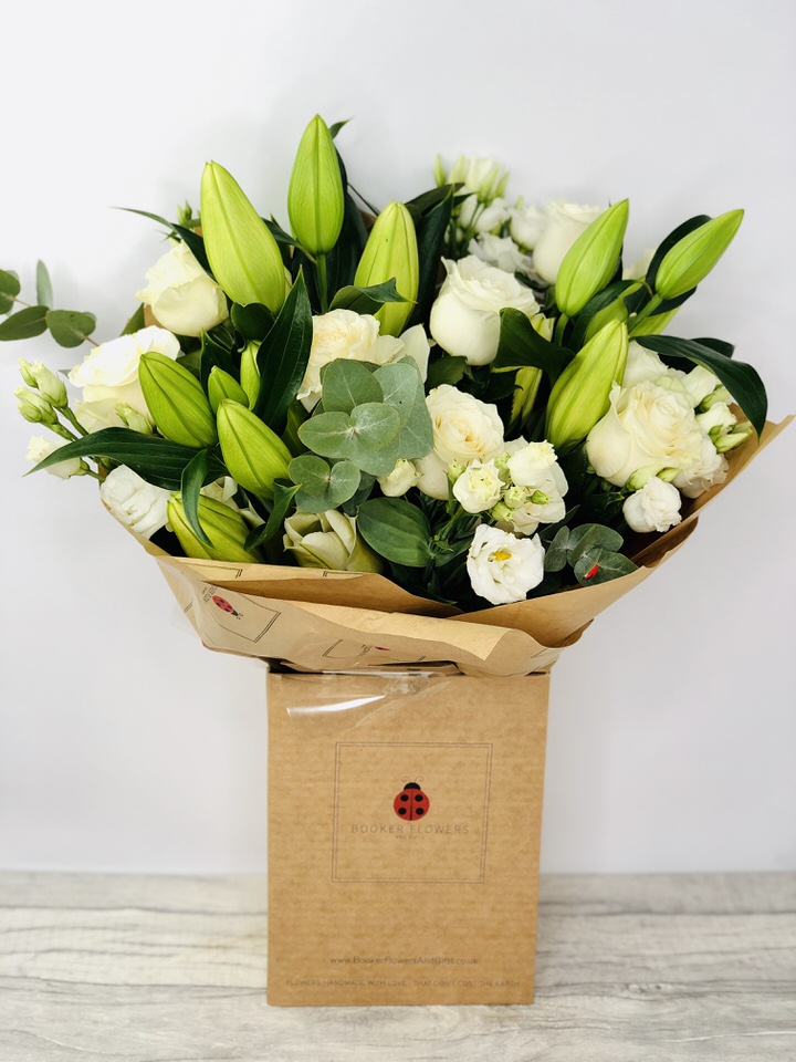 <h2>Beautiful White Celebration Bouquet - Hand-Delivered</h2>
<br>
<ul>
<li>Approximate Dimensions: 50cm x 50cm</li>
<li>Flowers arranged by hand and gift wrapped in our signature eco-friendly packaging and finished off with a hidden wooden ladybird</li>
<li>To give you the best occasionally we may make substitutes</li>
<li>Our flowers backed by our 7 days freshness guarantee</li>
<li>For delivery area coverage see below</li>
</ul>
<br>
<h2>Flower Delivery Coverage</h2>
<p>Our shop delivers flowers to the following Liverpool postcodes L1 L2 L3 L4 L5 L6 L7 L8 L11 L12 L13 L14 L15 L16 L17 L18 L19 L24 L25 L26 L27 L36 L70 If your order is for an area outside of these we can organise delivery for you through our network of florists. We will ask them to make as close as possible to the image but because of the difference in stock and sundry items it may not be exact.</p>
<br>
<h2>Hand-tied Bouquet | Flowers in box with water</h2>
<p>These beautiful flowers hand-arranged by our professional florists into a hand-tied bouquet are a delightful choice from our new collection. This white bouquet would make the perfect gift to celebrate any occasion.</p>
<p>Handtied bouquets are a lovely display of fresh flowers that have the wow factor. The advantage of having a bouquet made this way is that they are artfully arranged by our florists and tied so that they stay in the display.</p>
<p>They are then gift wrapped and aqua packed in a water bubble so that at no point are the flowers out of water. This means they look their very best on the day they arrive and continue to delight for days after.</p>
<p>Being delivered in a transporter box and in water means the recipient does not need to put the flowers in a vase straight away they can just put them down and enjoy.</p>
<p>Featuring 3 white oriental, 11 white roses, and 4 white lisianthus, together with mixed seasonal foliage including eucalyptus.</p>
<br>
<h2>Eco-Friendly Liverpool Florists</h2>
<p>As florists we feel very close earth and want to protect it. Plastic waste is a huge problem in the florist industry so we made the decision to make our packaging eco-friendly.</p>
<p>To achieve this we worked with our packaging supplier to remove the lamination off our boxes and wrap the tops in an Eco Flowerwrap which means it easily compostable or can be fully recycled.</p>
<p>Once you have finished enjoying your flowers from us they will go back into growing more flowers! Only a small amount of plastic is used as a water bubble and this is biodegradable.</p>
<p>Even the sachet of flower food included with your bouquet is compostable.</p>
<p>All our bouquets have small wooden ladybird hidden amongst them so do not forget to spot the ladybird and post a picture on our social media pages to enter our rolling competition.</p>
<br>
<h2>Flowers Guaranteed for 7 Days</h2>
<p>Our 7-day freshness guarantee should give you confidence that we will only send out good quality flowers.</p>
<p>Leave it in our hands we will create a marvellous bouquet which will not only look good on arrival but will continue to delight as the flowers bloom.</p>
<br>
<h2>Liverpool Flower Delivery</h2>
<p>We are open 7 days a week and offer advanced booking flower delivery same-day flower delivery 3-hour flower delivery. Guaranteed AM PM or Evening Flower Delivery and also offer Sunday Flower Delivery.</p>
<p>Our florists deliver in Liverpool and can provide flowers for you in Liverpool Merseyside. And through our network of florists can organise flower deliveries for you nationwide.</p>
<br>
<h2>The Best Florist in Liverpool your local Liverpool Flower Shop</h2>
<p>Come to Booker Flowers and Gifts Liverpool for your beautiful flowers and plants. For that bit of extra luxury we also offer a lovely range of finishing touches such as wines champagne locally crafted Gin and Rum Vases Scented Candles and Chocolates that can be delivered with your flowers.</p>
<p>To see the full range see our extras section.</p>
<p>You can trust Booker Flowers and Gifts of delivery the very best for you.</p>
<p><br /><br /></p>
<p><em>5 Star review on Yell.com</em></p>
<br>
<p><em>Thank you Gemma for your fabulous service. The flowers are of the highest quality and delivered with a warm smile. My sister was delighted. Ordering was simple and the communications were top-notch. I will definitely use your services again.</em></p>